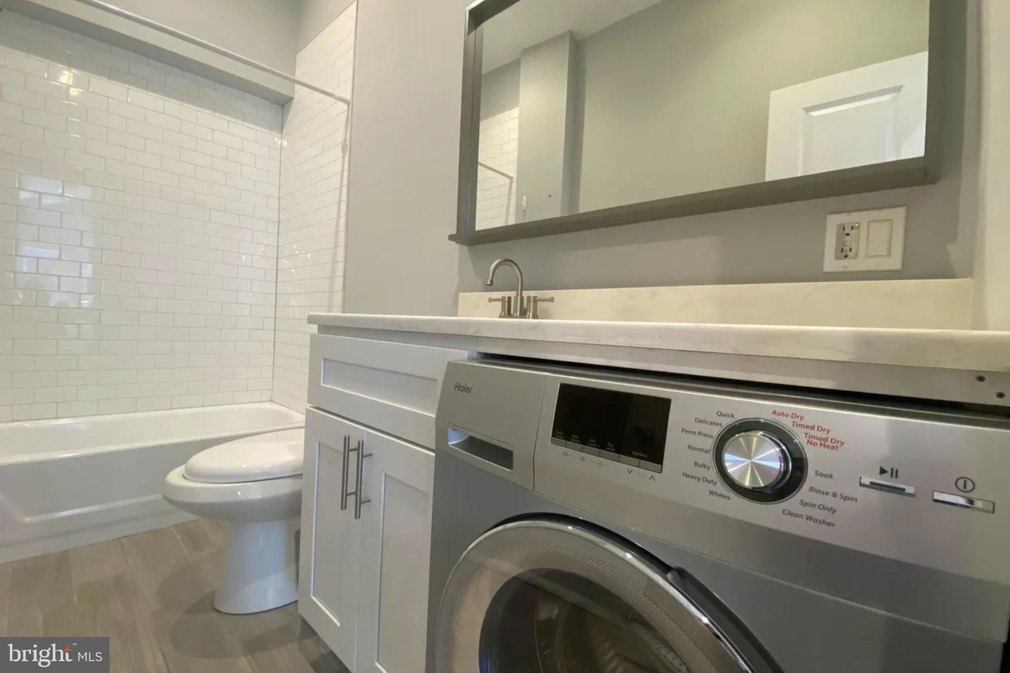 1616 Spruce Street, Unit 3R Philadelphia, PA 19103 - Photo 9 of 9 a bathroom with a sink a toilet and a mirror