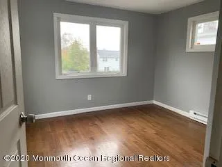 a bathroom with a toilet a sink and a mirror