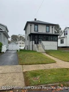 a view of front door of house with yard