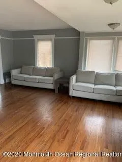 a view of living room filled with furniture and window