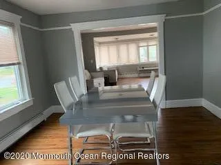 a kitchen with stainless steel appliances a refrigerator a sink a stove a microwave and wooden cabinets