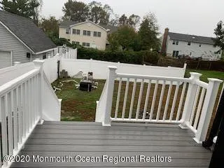 a view of a house with wooden deck