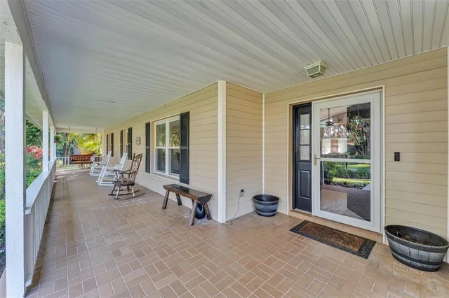 a lobby with furniture and floor to ceiling window