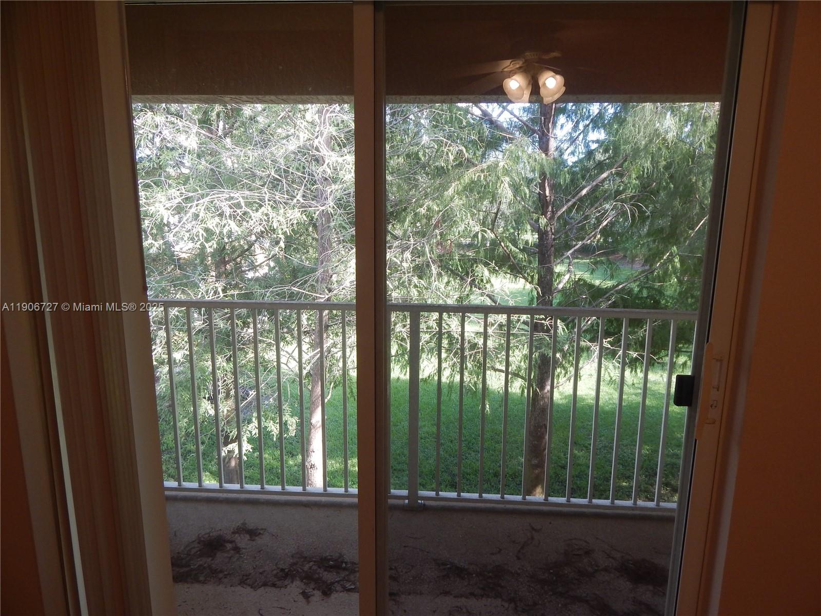 4622 Southwest 75th Way, Unit 102 Davie, FL 33314 - Photo 8 of 16 a view of a garden from a window