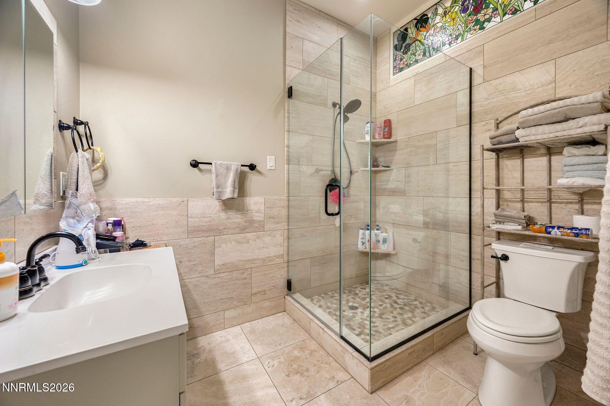 250 Jacks Valley Ranch Road Carson City, NV 89705 - Photo 26 of 44 a bathroom with a sink toilet and shower