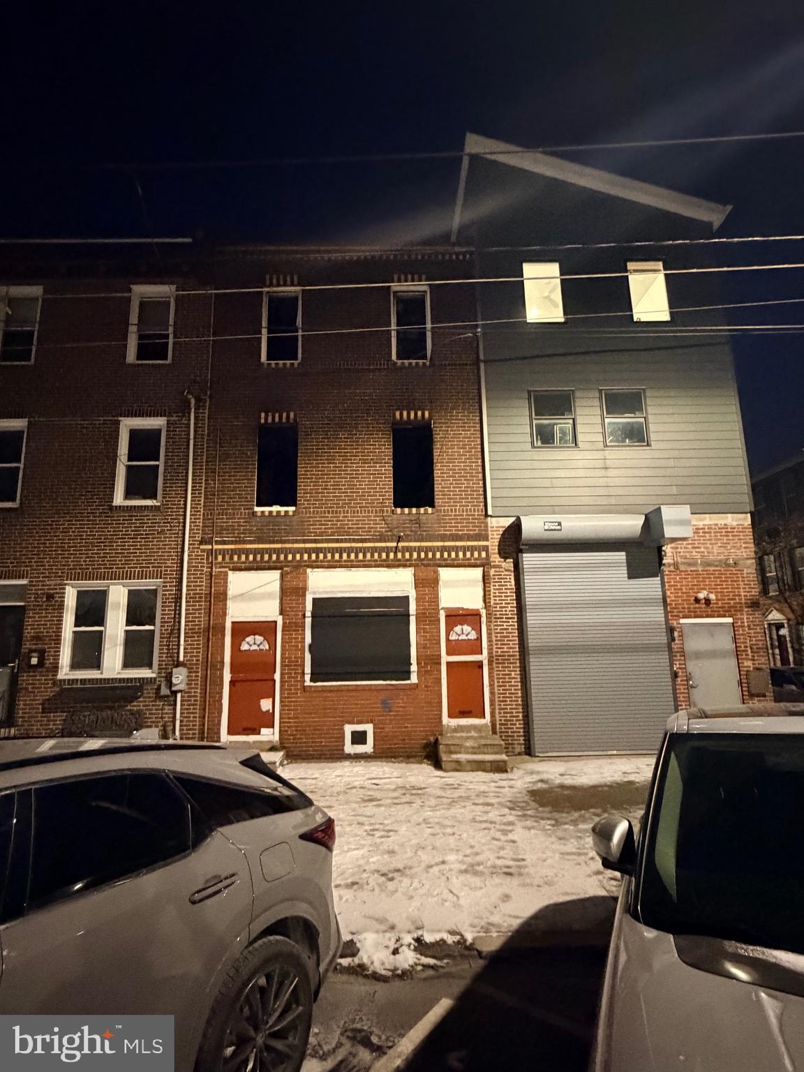 a front view of a house with backyard