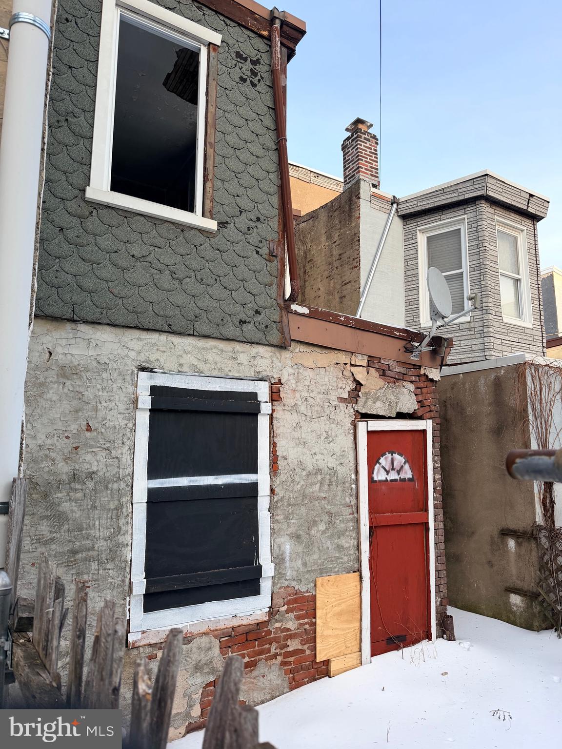 2716 East Lehigh Avenue Philadelphia, PA 19125 - Photo 6 of 7 a brick building with a door and a yard