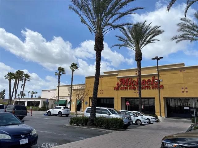 a view of street with parked cars