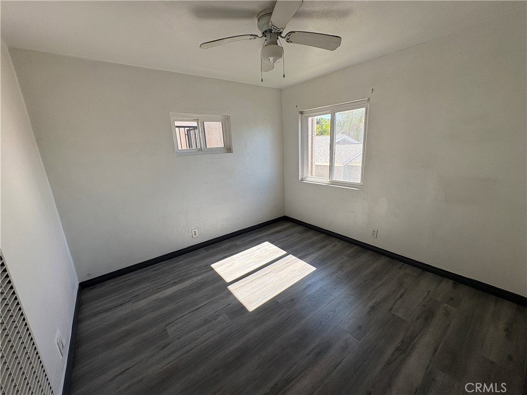 9148 Verner Street, Unit A Pico Rivera, CA 90660 - Photo 7 of 14 wooden floor in an empty room with a window