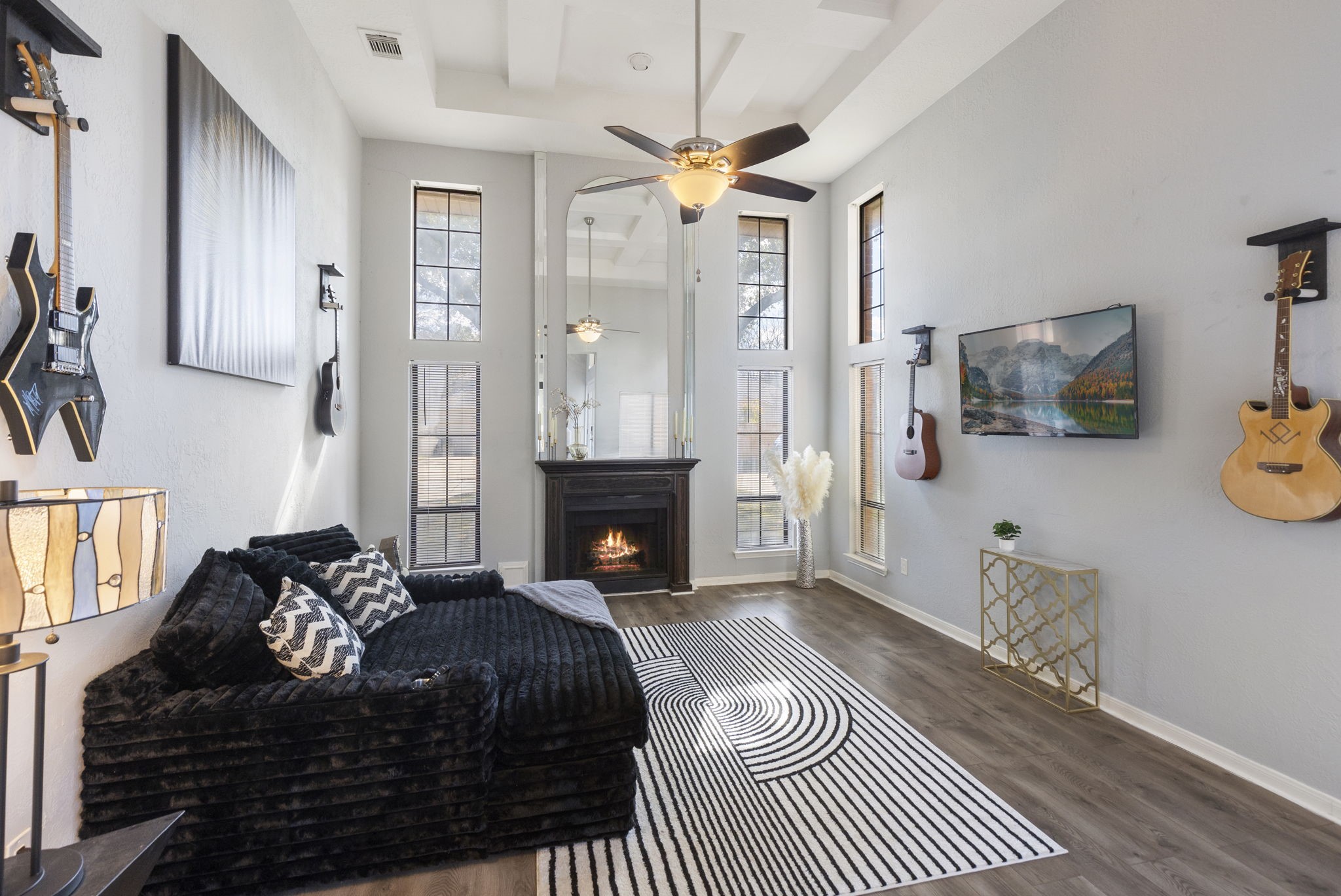 2110 Paso Rello Drive Houston, TX 77077 - Photo 7 of 41 This inviting living room features high ceilings, abundant natural light from tall windows, and a cozy fireplace.