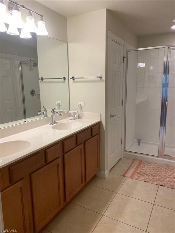 7310 Salerno Court Naples, FL 34114 - Photo 22 of 46 Primary Bath with Two Sinks & Walk-In Shower