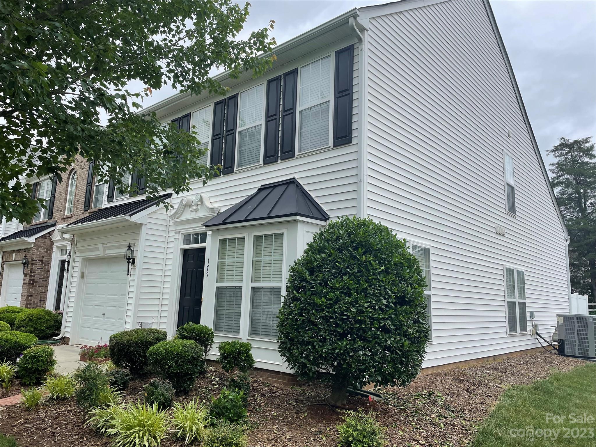 179 Snead Road Fort Mill, SC 29715 - Photo 2 of 48 a view of a white house next to a yard