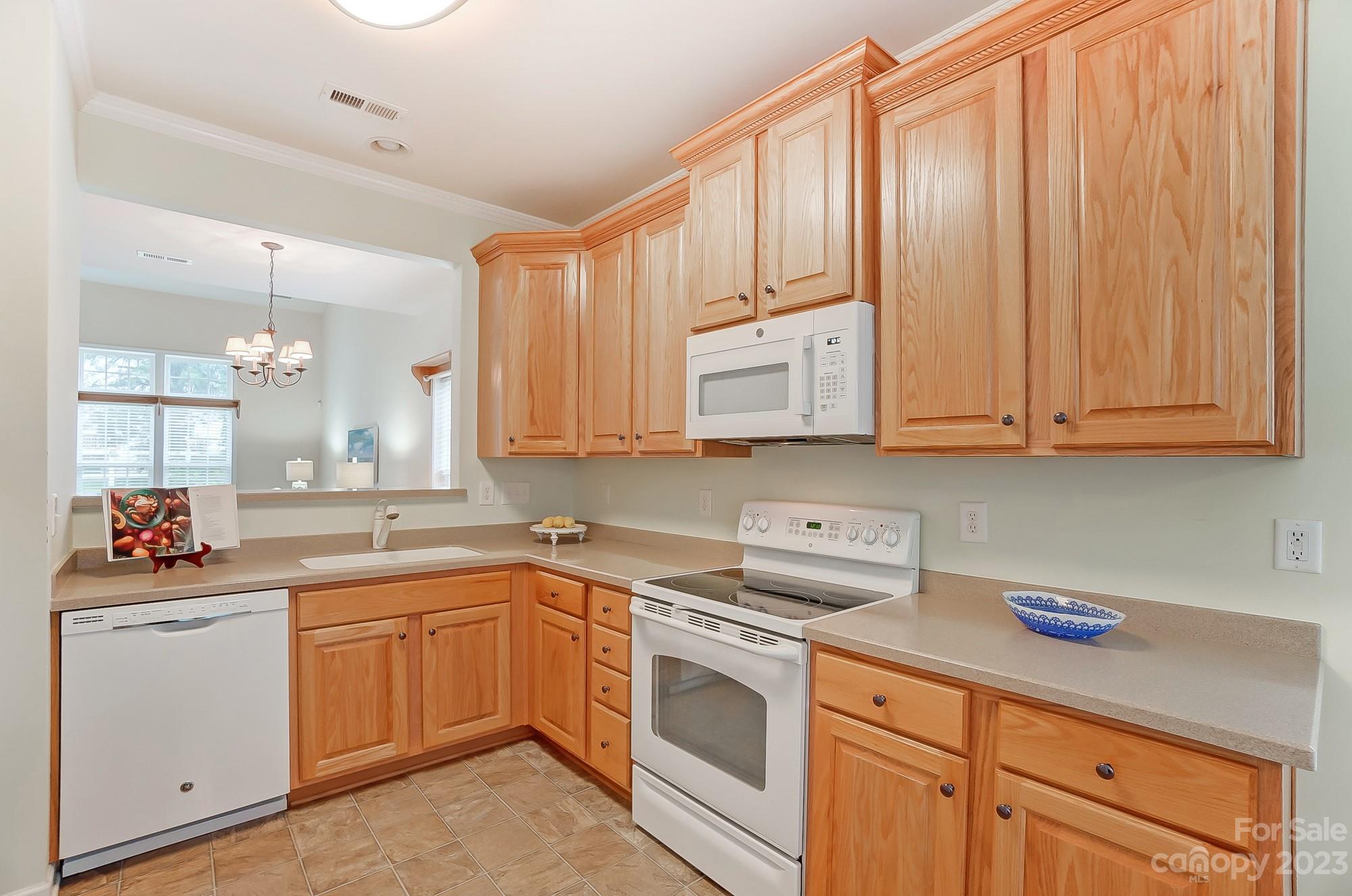 179 Snead Road Fort Mill, SC 29715 - Photo 21 of 48 a kitchen with a sink stove and cabinets