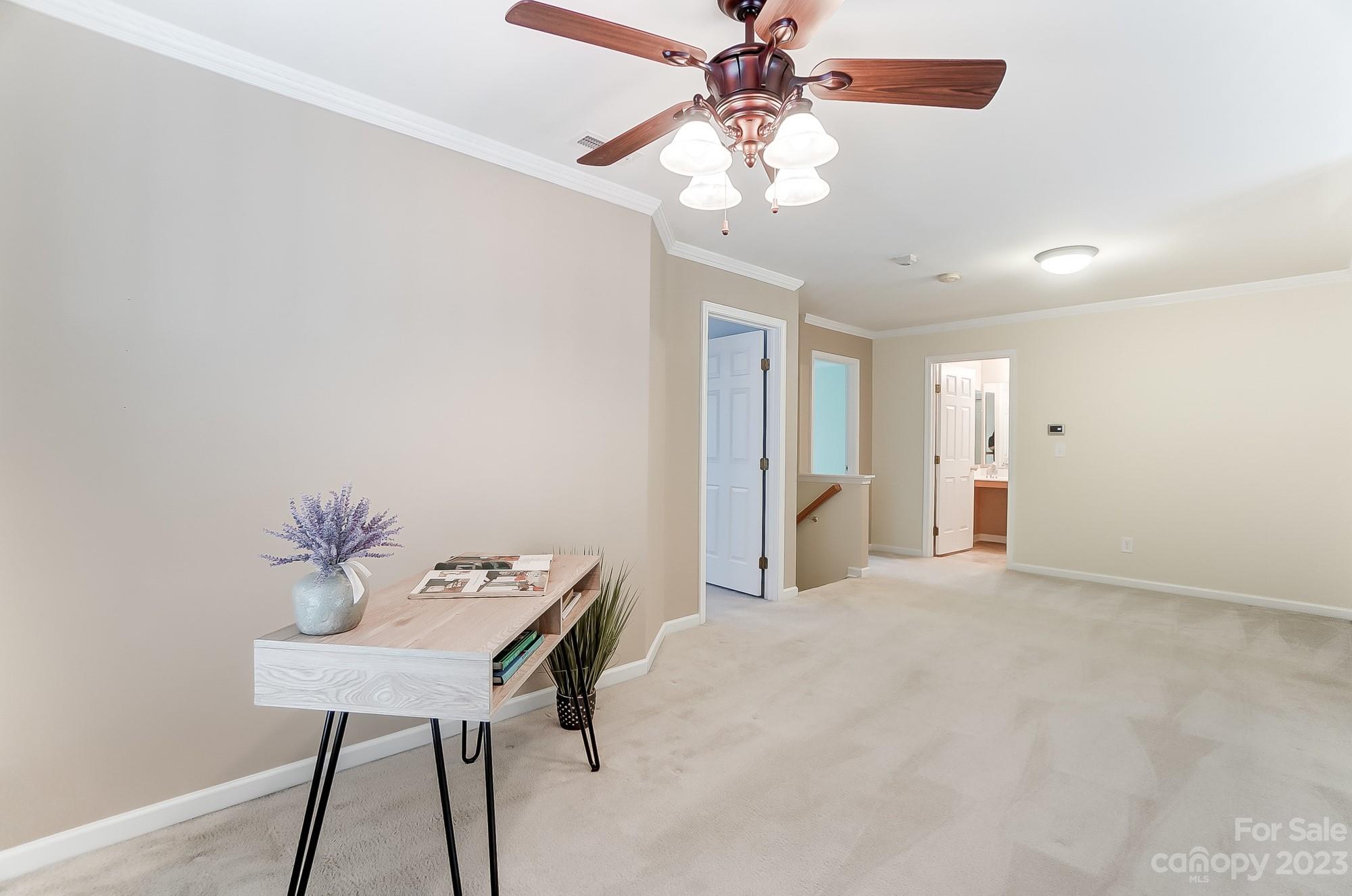 179 Snead Road Fort Mill, SC 29715 - Photo 27 of 48 a view of a workspace with furniture and a chandelier fan