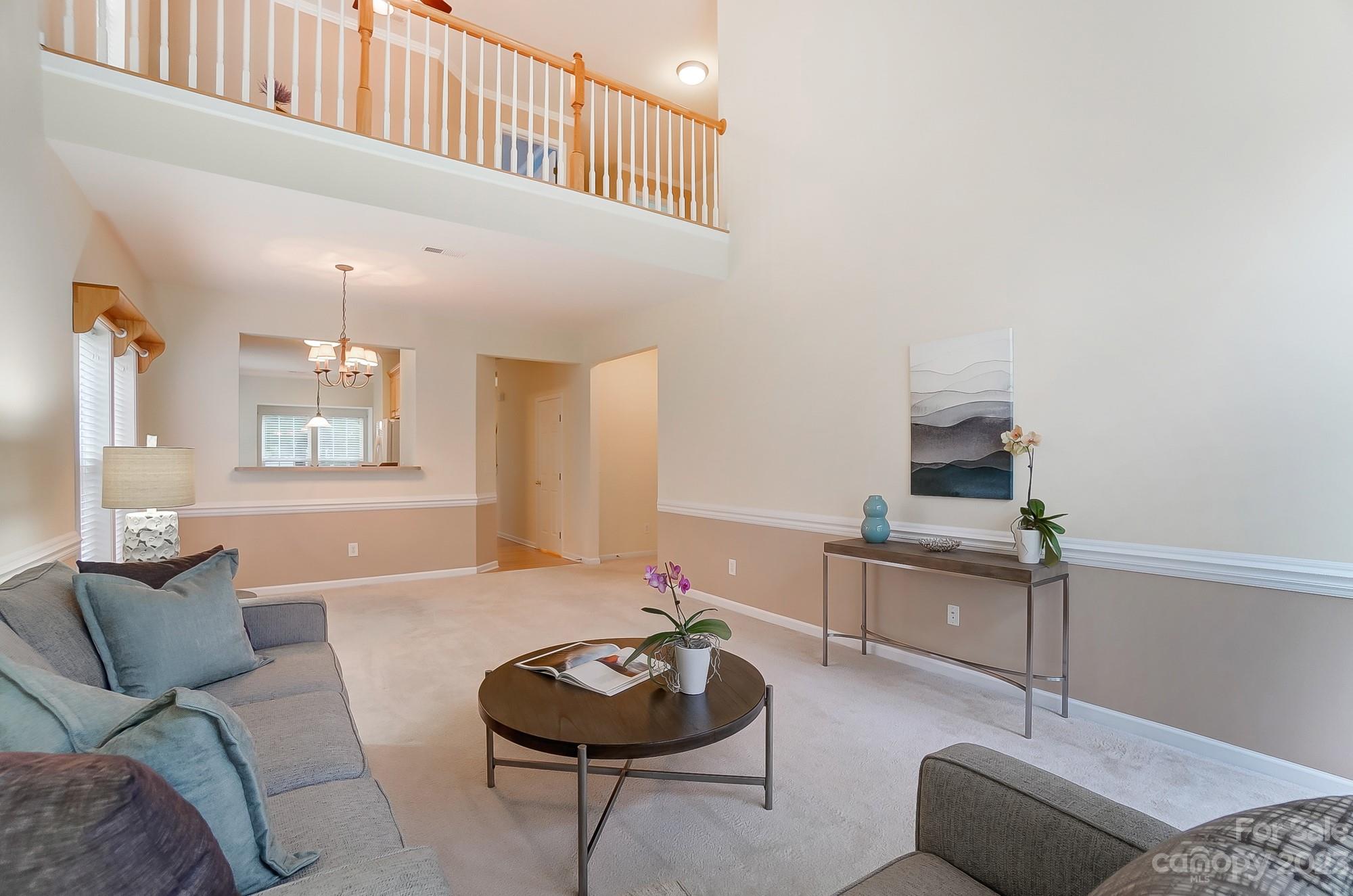 179 Snead Road Fort Mill, SC 29715 - Photo 10 of 48 a living room with furniture and a wooden floor