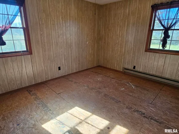 an empty room with windows