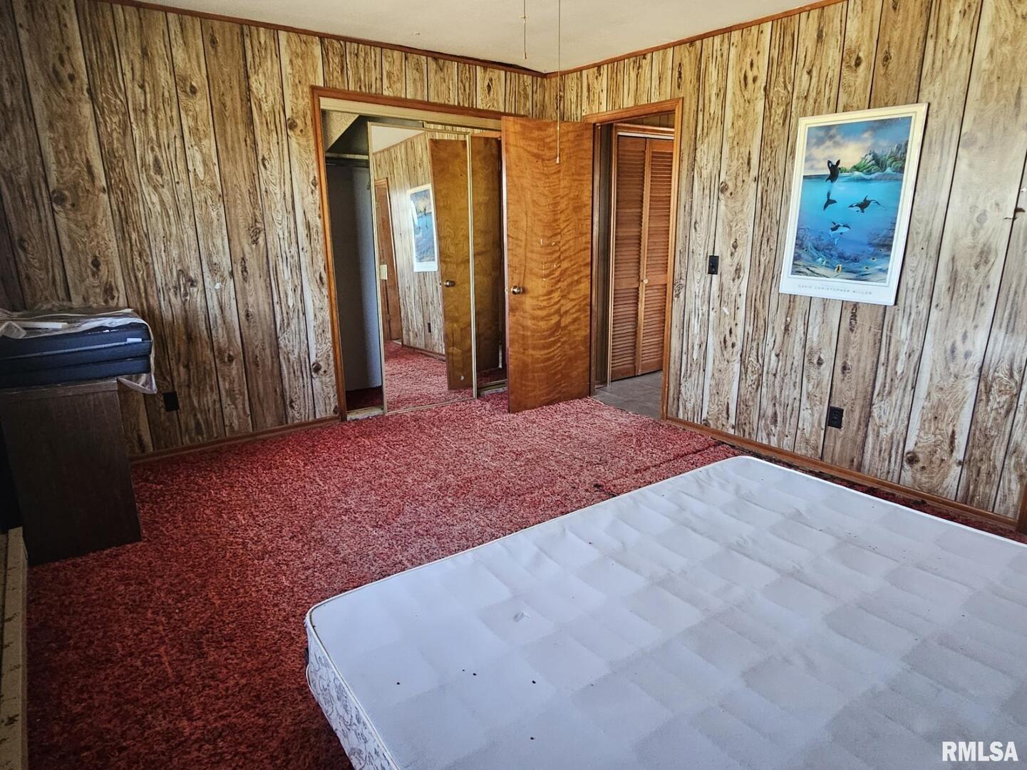 3830 Highway 147 Vienna, IL 62995 - Photo 19 of 23 a view of a bedroom with wooden floor and walls