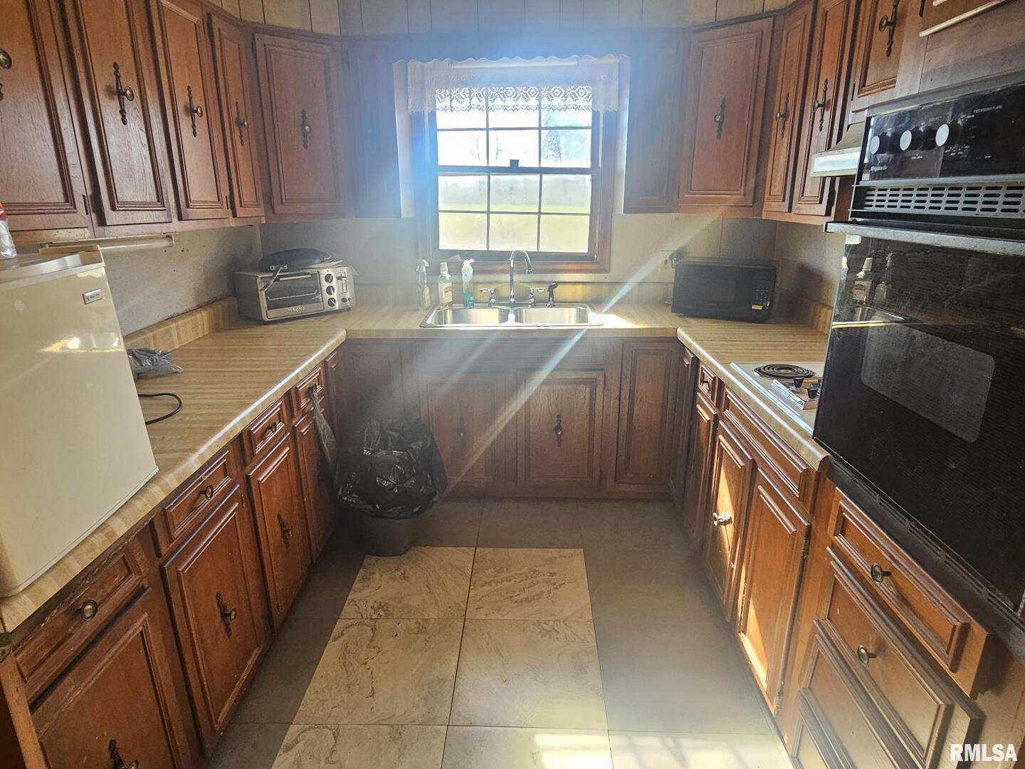 3830 Highway 147 Vienna, IL 62995 - Photo 4 of 23 a kitchen with a sink a stove and cabinets
