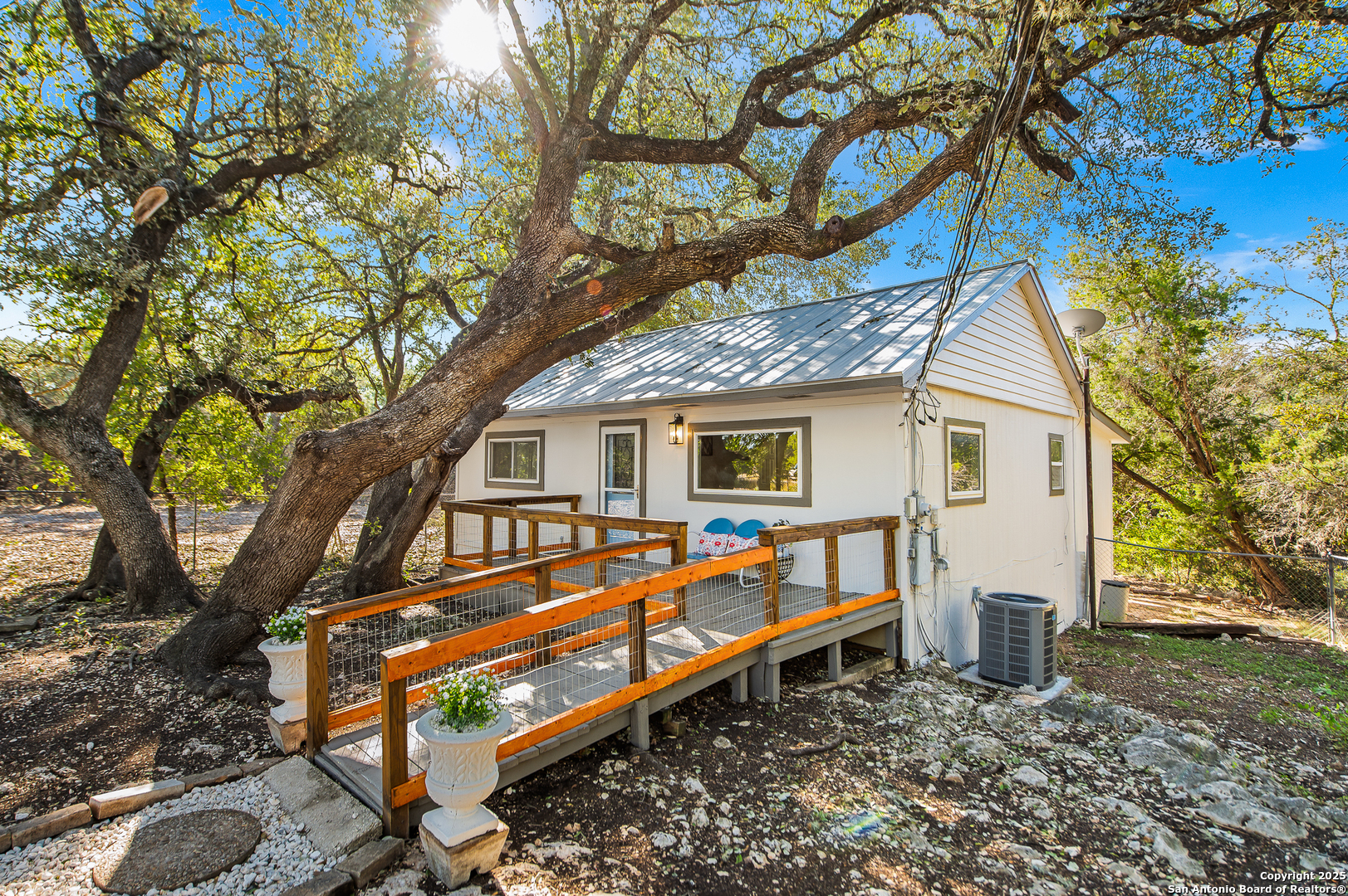 1230 Echo Meadow Lane Spring Branch, TX 78070 - Photo 1 of 31 a house view with a backyard and a tree