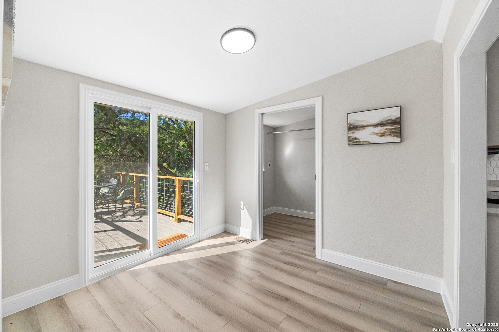 1230 Echo Meadow Lane Spring Branch, TX 78070 - Photo 17 of 31 an empty room with wooden floor and windows