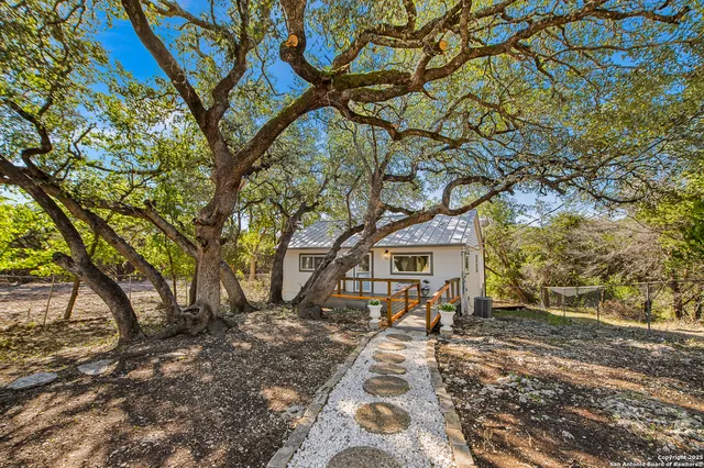 a house with trees in front of it