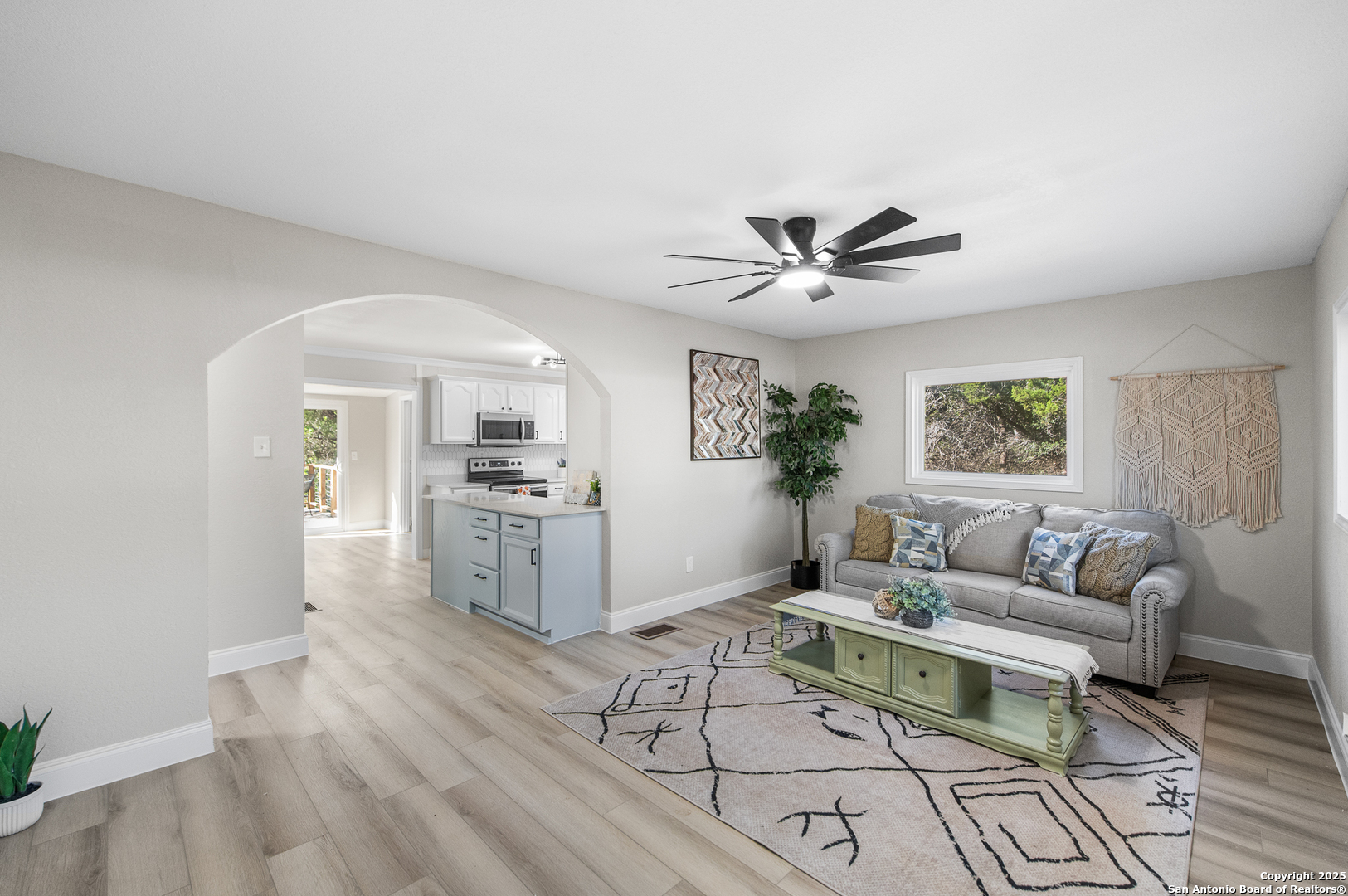 1230 Echo Meadow Lane Spring Branch, TX 78070 - Photo 6 of 31 a living room with furniture and a large window with wooden floor