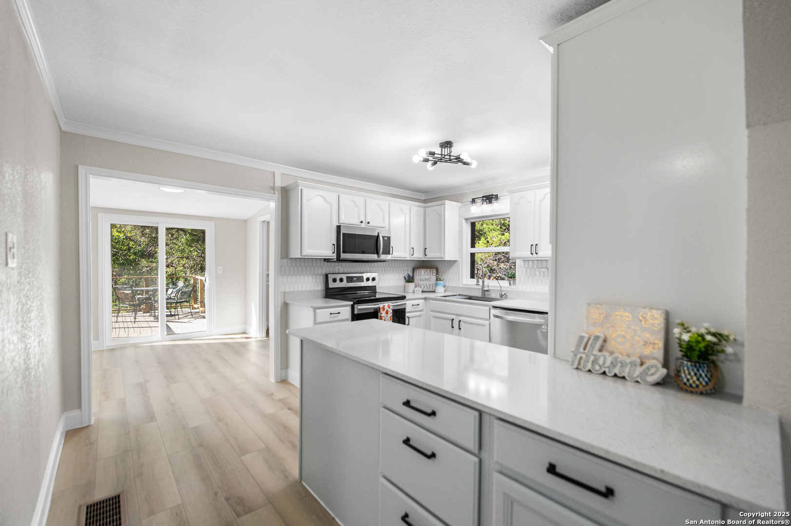 1230 Echo Meadow Lane Spring Branch, TX 78070 - Photo 7 of 31 a kitchen with appliances a counter space and cabinets