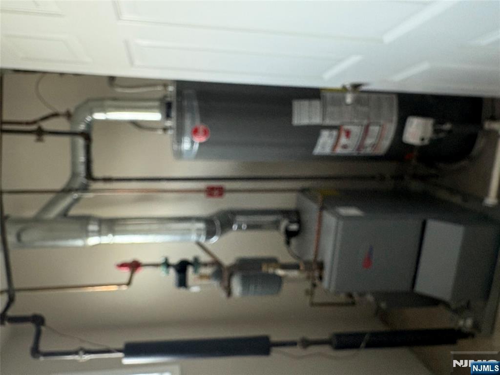 70 Pink Street, Unit 2 Hackensack, NJ 07601 - Photo 13 of 13 a bathroom with a sink toilet and shower