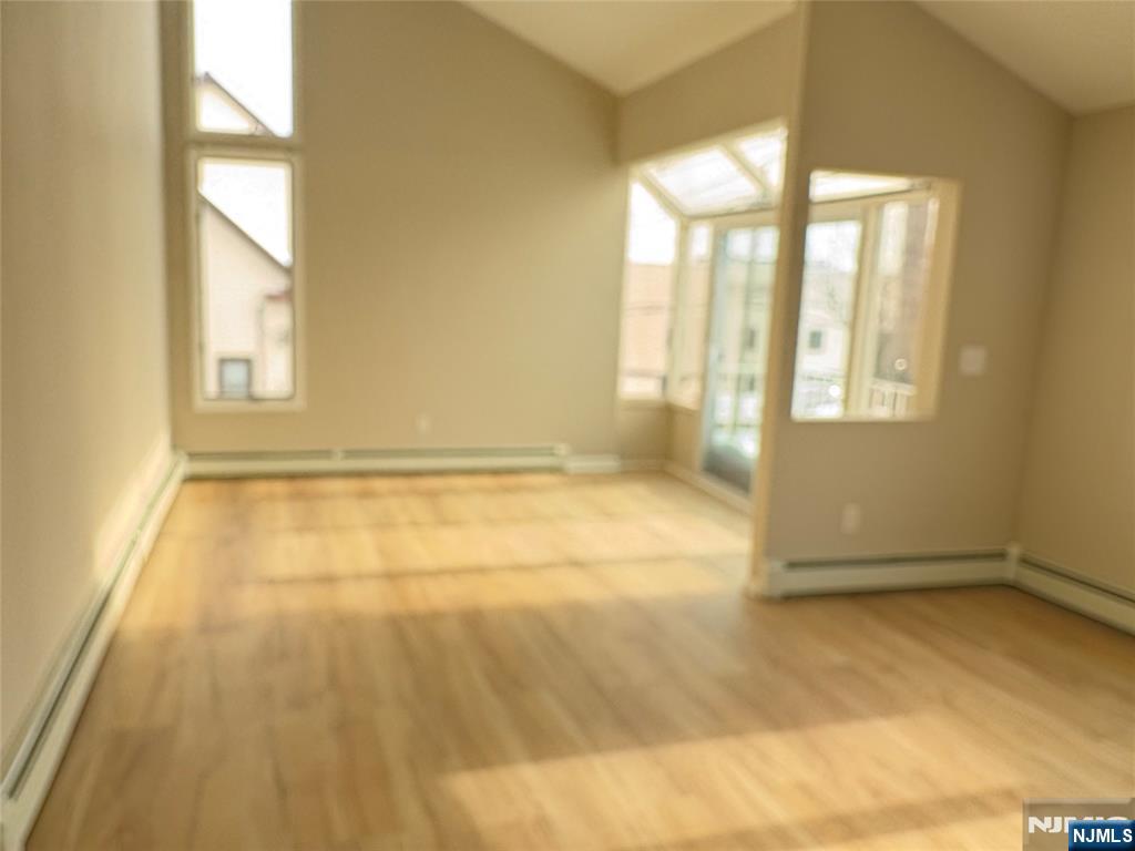 70 Pink Street, Unit 2 Hackensack, NJ 07601 - Photo 4 of 13 a view of an empty room with a window
