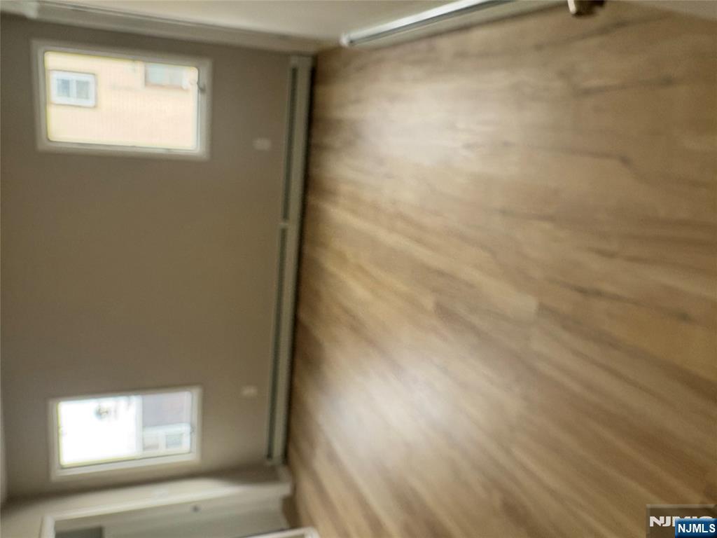 70 Pink Street, Unit 2 Hackensack, NJ 07601 - Photo 7 of 13 an empty room with a window