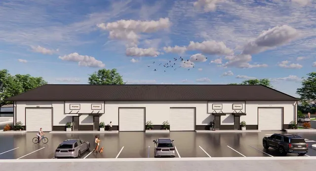 an outdoor sitting area with a barbeque