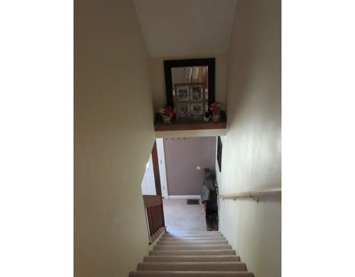 113 Draper Road East Brookfield, MA 01515 - Photo 16 of 33 a view of a hallway with wooden floor and a bathroom