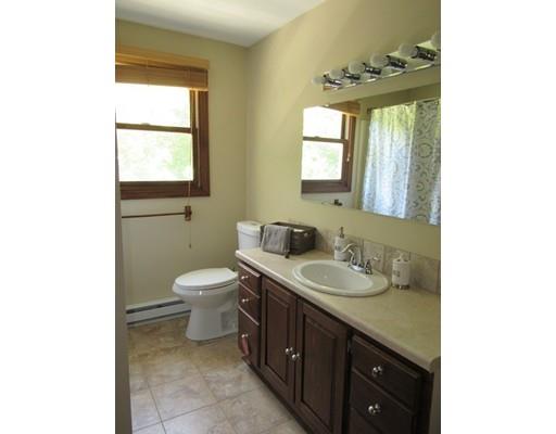 113 Draper Road East Brookfield, MA 01515 - Photo 24 of 33 a bathroom with a toilet sink and mirror