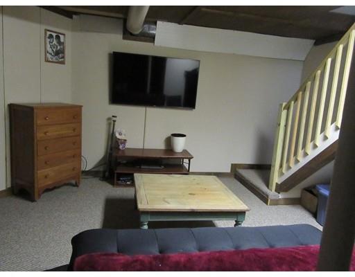 113 Draper Road East Brookfield, MA 01515 - Photo 27 of 33 a living room with furniture and a flat screen tv