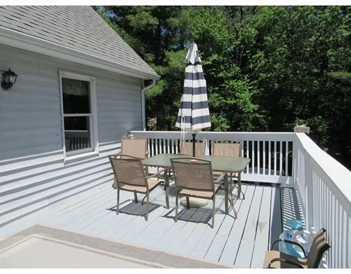 113 Draper Road East Brookfield, MA 01515 - Photo 32 of 33 a view of deck with table and chairs and wooden floor