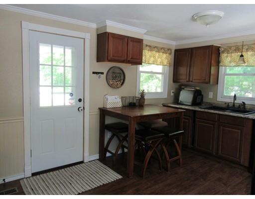 113 Draper Road East Brookfield, MA 01515 - Photo 10 of 33 a kitchen with a table chairs and a window