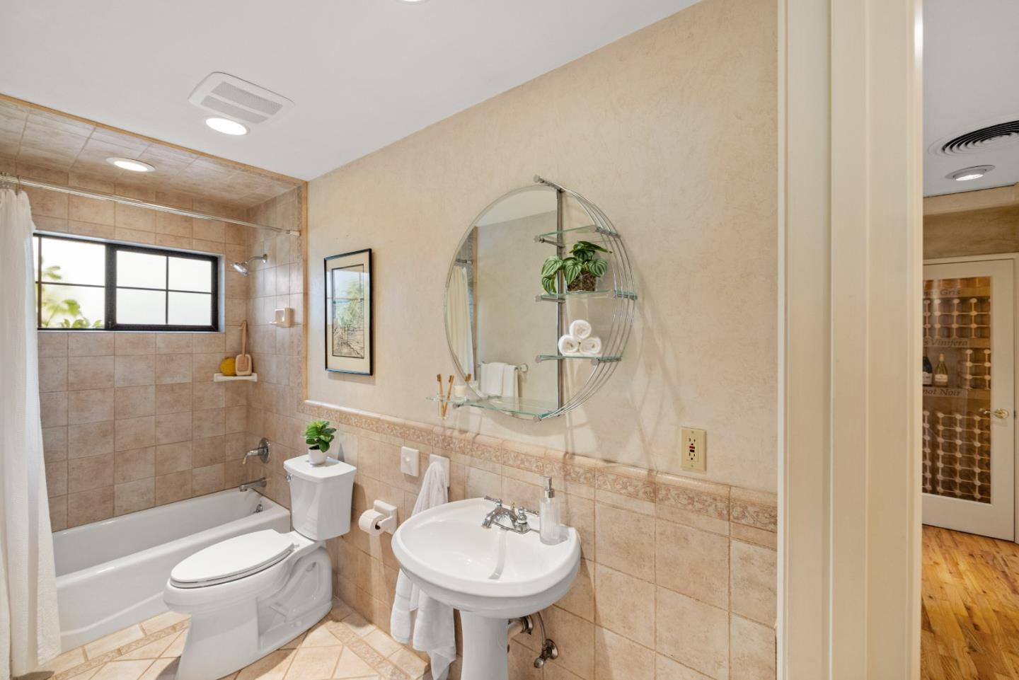 777 Parcel Street Monterey, CA 93940 - Photo 16 of 21 a bathroom with a sink toilet and shower