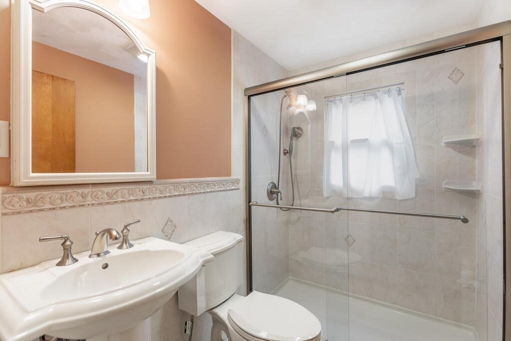 1 King Street Wakefield, MA 01880 - Photo 11 of 25 a bathroom with a sink toilet and shower