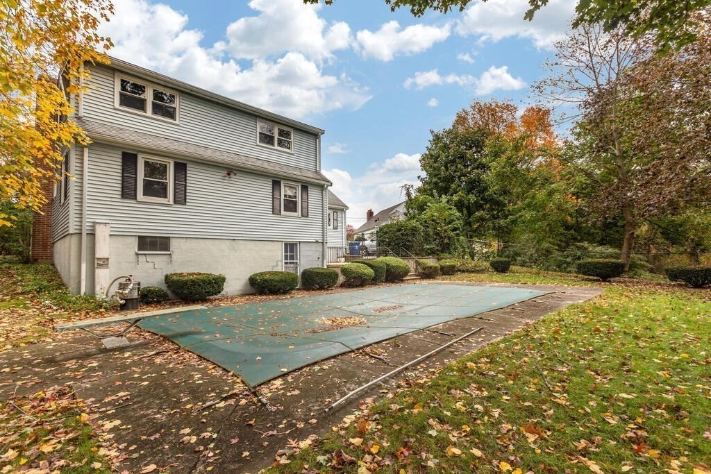 1 King Street Wakefield, MA 01880 - Photo 20 of 25 a front view of a house with a yard and garage