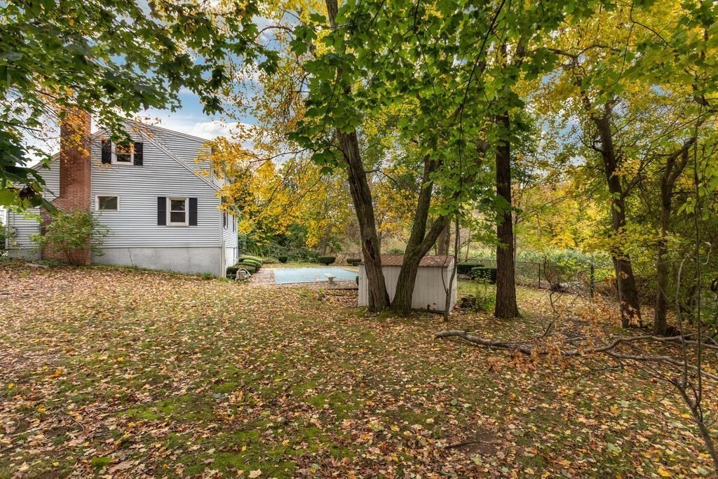 1 King Street Wakefield, MA 01880 - Photo 21 of 25 a house with trees in front of it