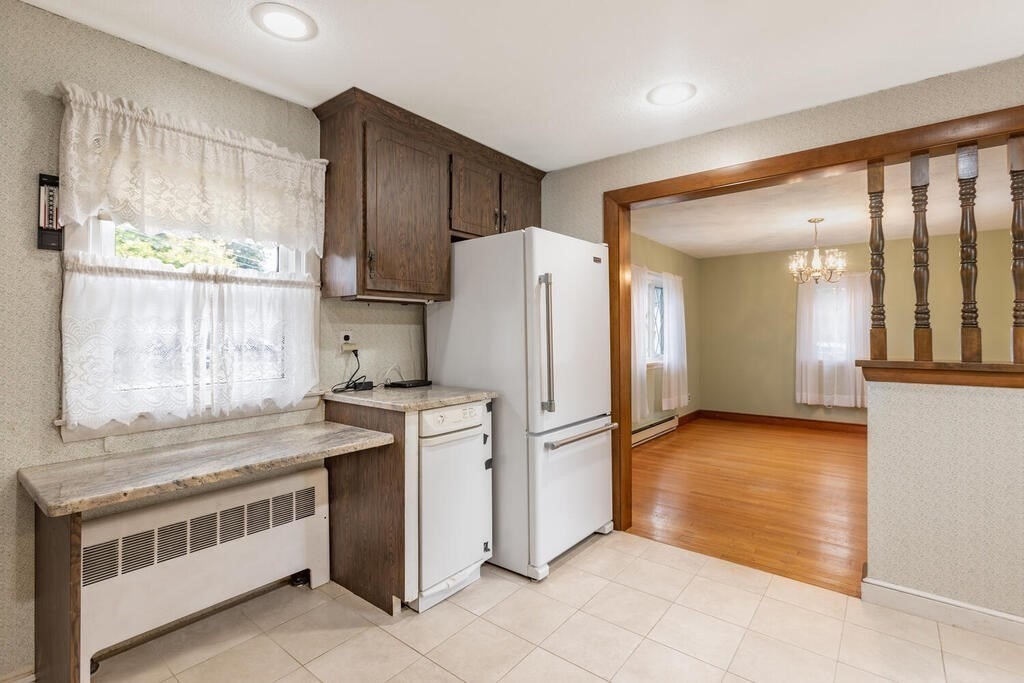 1 King Street Wakefield, MA 01880 - Photo 4 of 25 a kitchen with stainless steel appliances granite countertop a refrigerator and a stove