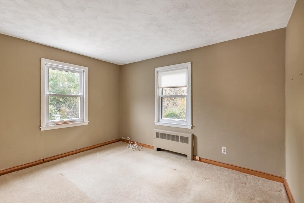 1 King Street Wakefield, MA 01880 - Photo 9 of 25 an empty room with windows