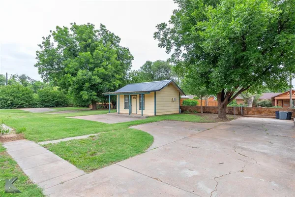 a front view of a house with yard