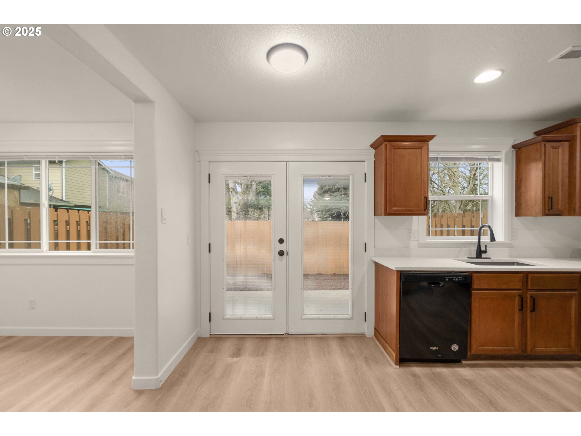 14553 Southeast Rhine Street Portland, OR 97236 - Photo 11 of 26 a kitchen with stainless steel appliances granite countertop a sink and a stove top oven