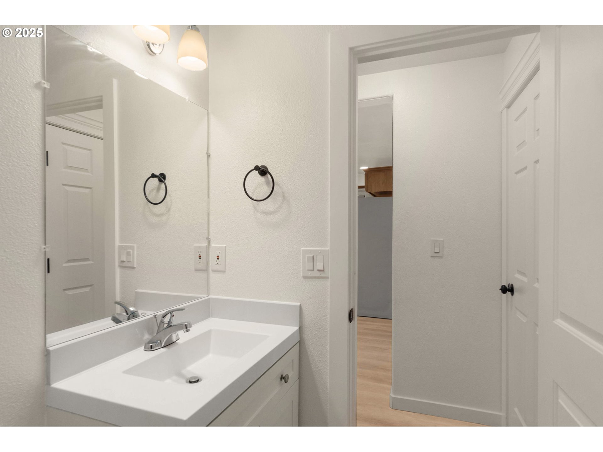 14553 Southeast Rhine Street Portland, OR 97236 - Photo 15 of 26 a bathroom with a sink mirror and shower