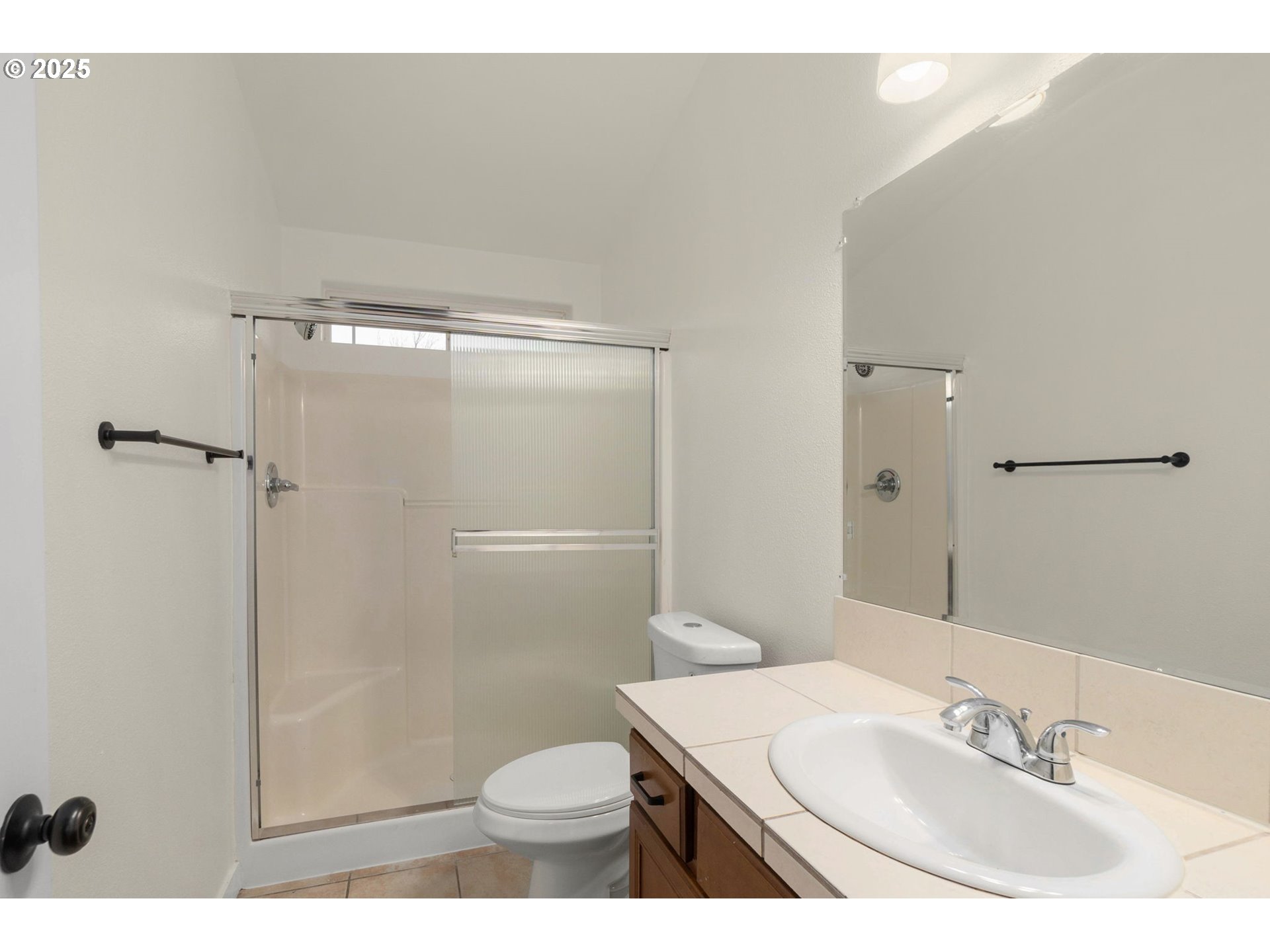 14553 Southeast Rhine Street Portland, OR 97236 - Photo 19 of 26 a bathroom with a sink toilet and shower