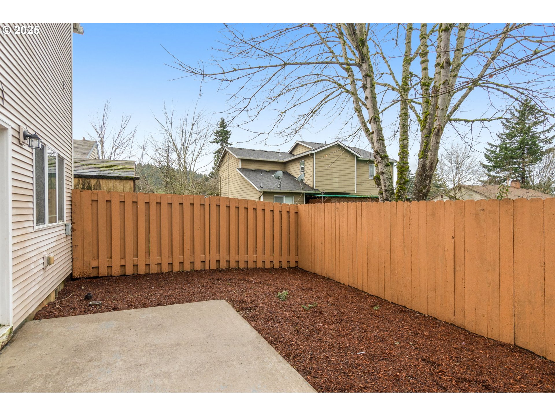 14553 Southeast Rhine Street Portland, OR 97236 - Photo 26 of 26 a view of a backyard with wooden fence