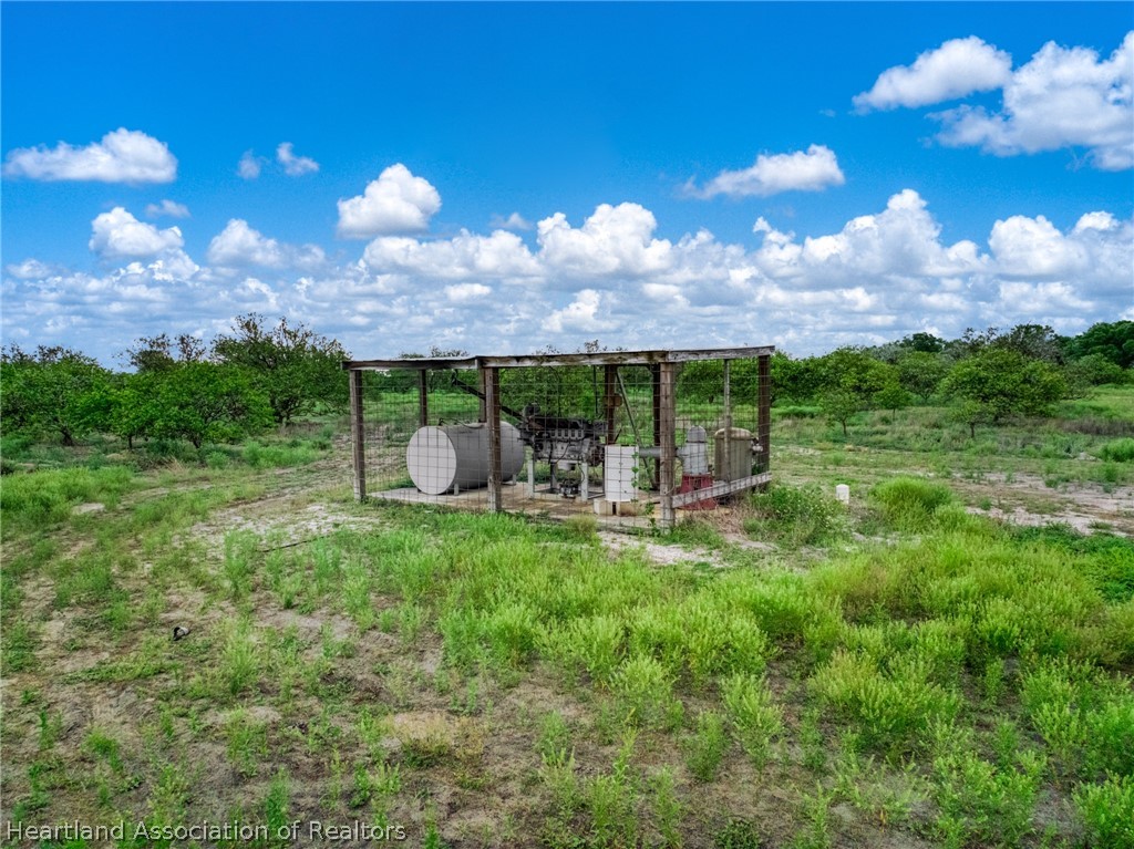 0 North Bailey Road Wauchula, FL 33873 - Photo 8 of 11 a view of a patio with table and chairs under an umbrella