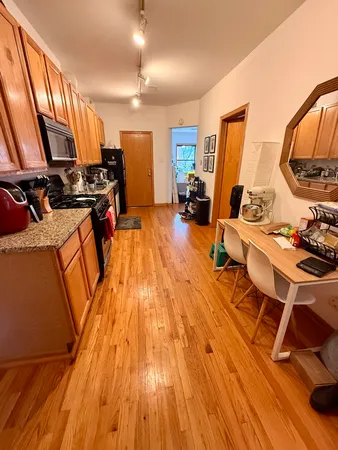 a room with wooden floors and furniture