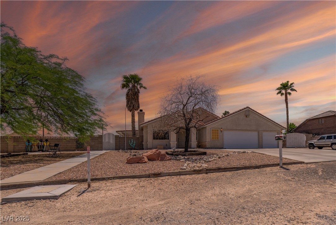 475 East Robindale Road Las Vegas, NV 89123 - Photo 1 of 41 View of front of house featuring a garage and concrete driveway